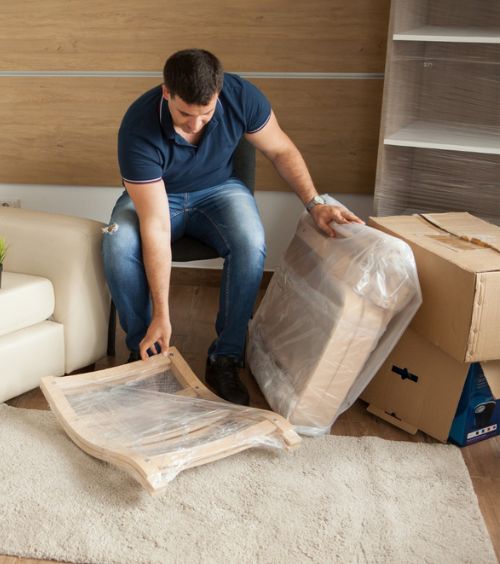 Young couple shifting furniture to relocate to new house