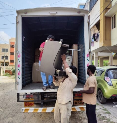 Our packers and movers shifting furniture from home to truck for home shifting